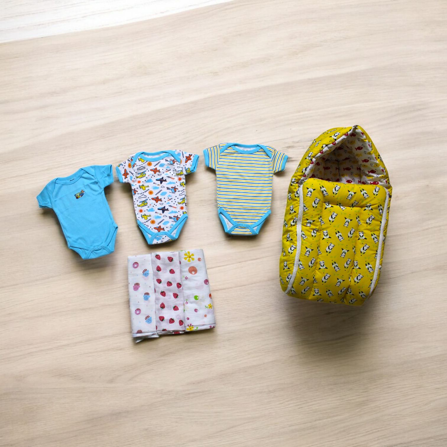 Organic Cotton Onesies & Muslin Swaddles With Yellow Sleeping Bag