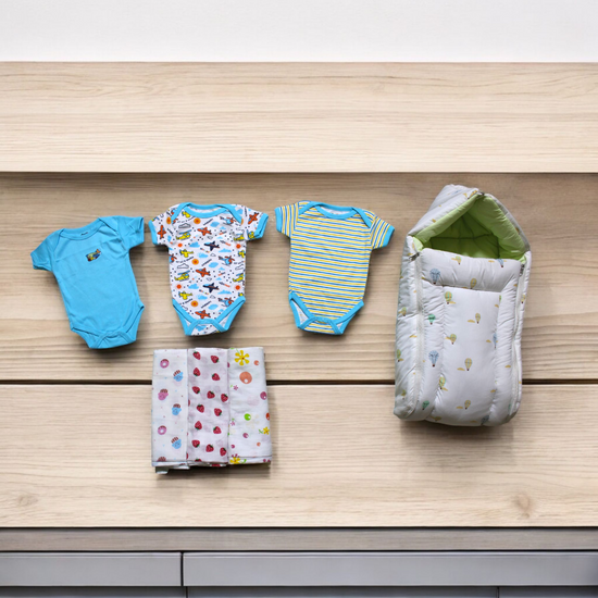 Organic Cotton Onesies & Muslin Swaddles With White Sleeping Bag